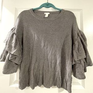 H&M. Silver sparkly shirt with flare 3/4 length sleeves. Size L.